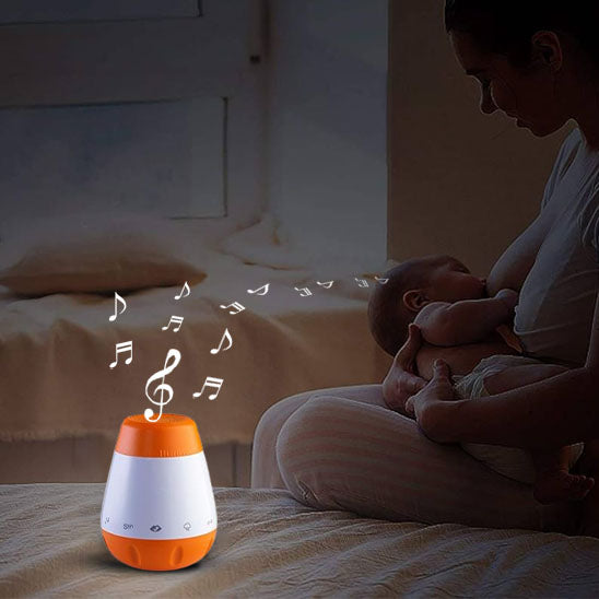 Maman allaitant son bébé dans une ambiance apaisée par la veilleuse LumiZen
