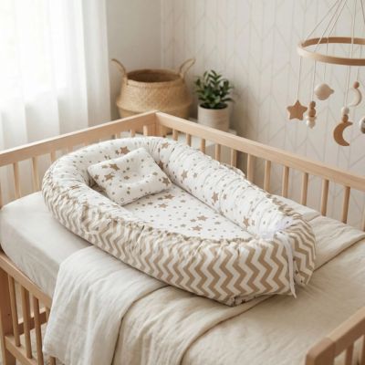 cocon bébé ergonomique dans lit bébé