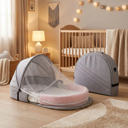 Lit bébé portable gris avec moustiquaire